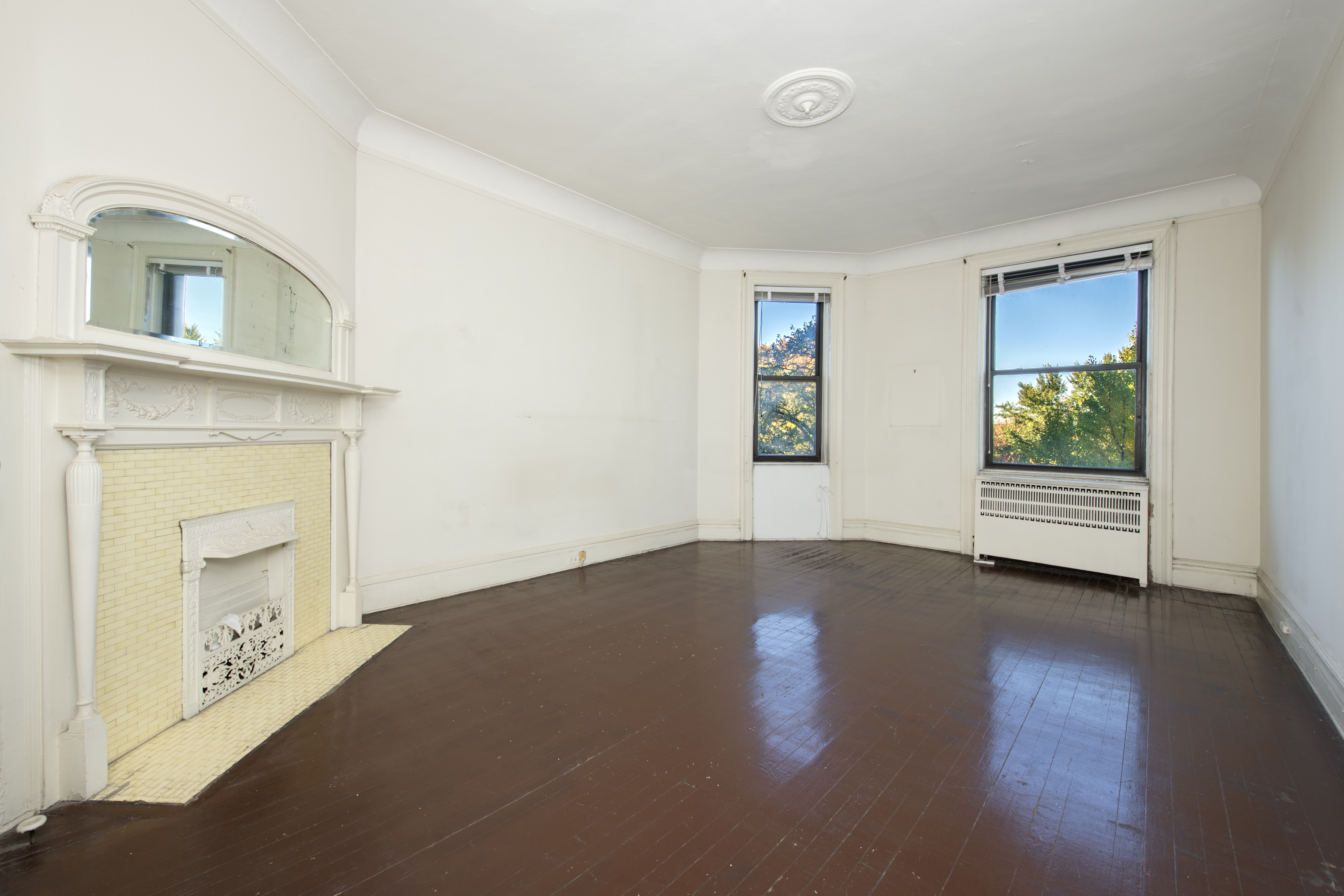 194 Riverside Drive, Unit 5E Manhattan, NY 10025 - Photo 9 of 26 a view of empty room with wooden floor and fan