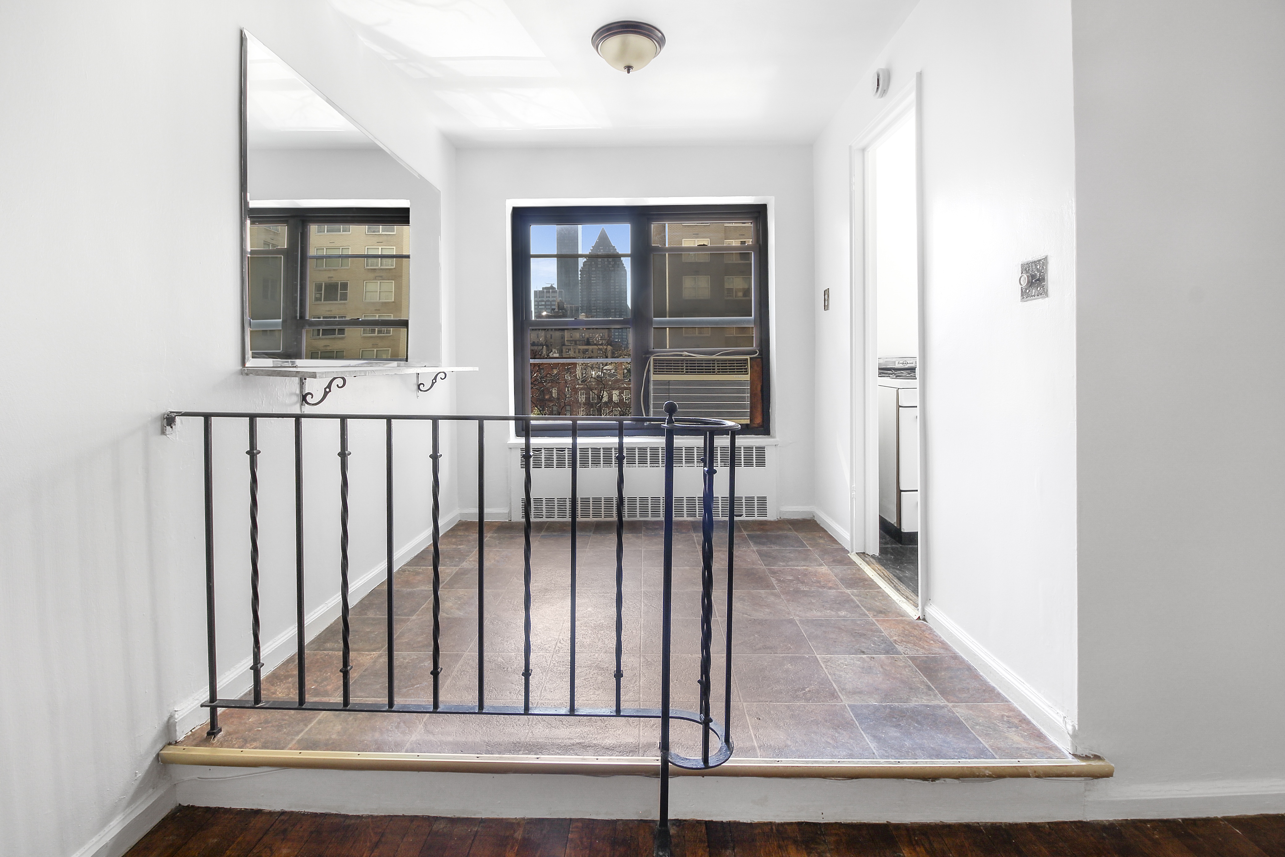 315 East 56th Street, Unit 5H Manhattan, NY 10022 - Photo 3 of 9 an entryway with wooden floor
