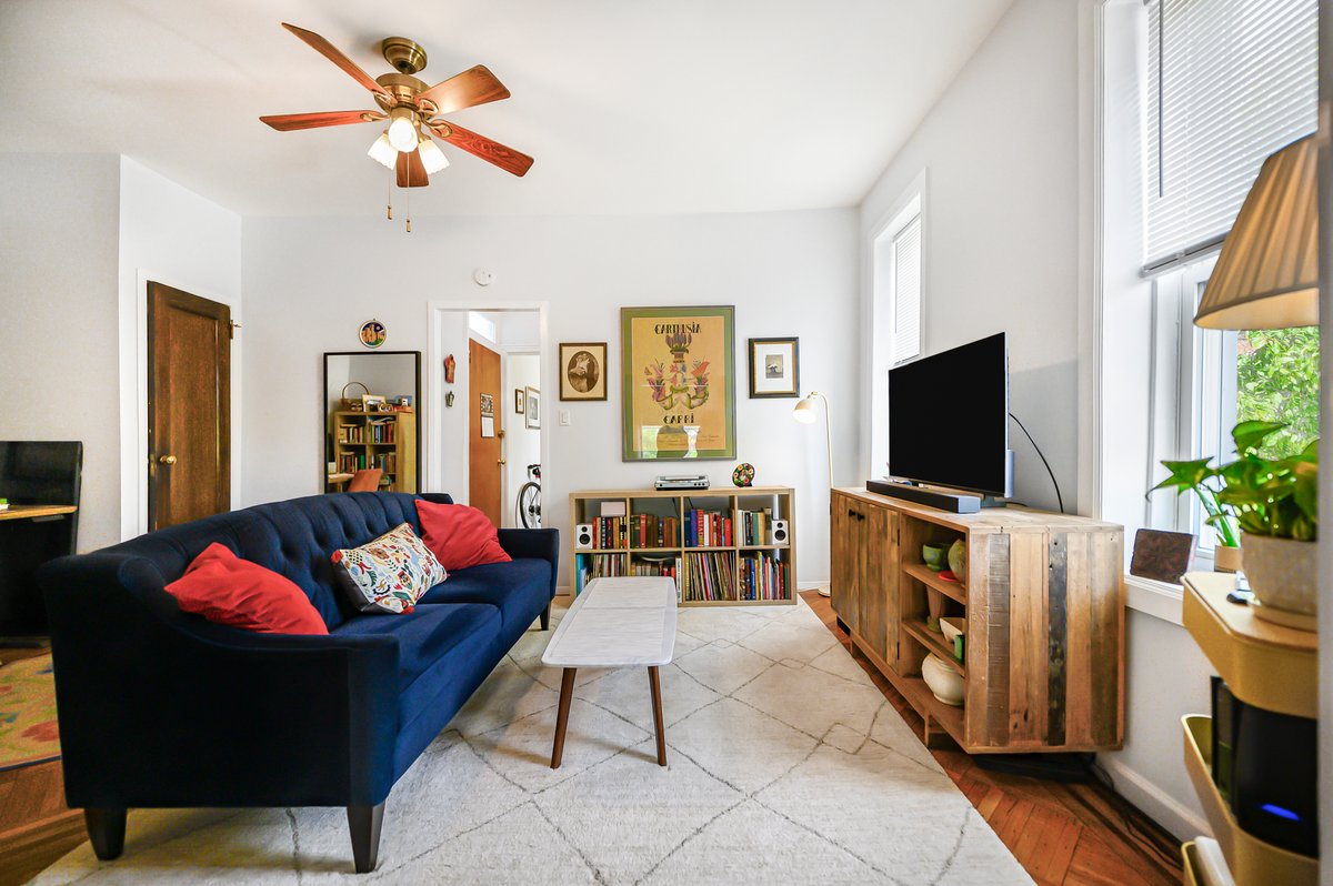 1702 11th Avenue Brooklyn, NY 11218 - Photo 10 of 25 a living room with furniture and a flat screen tv