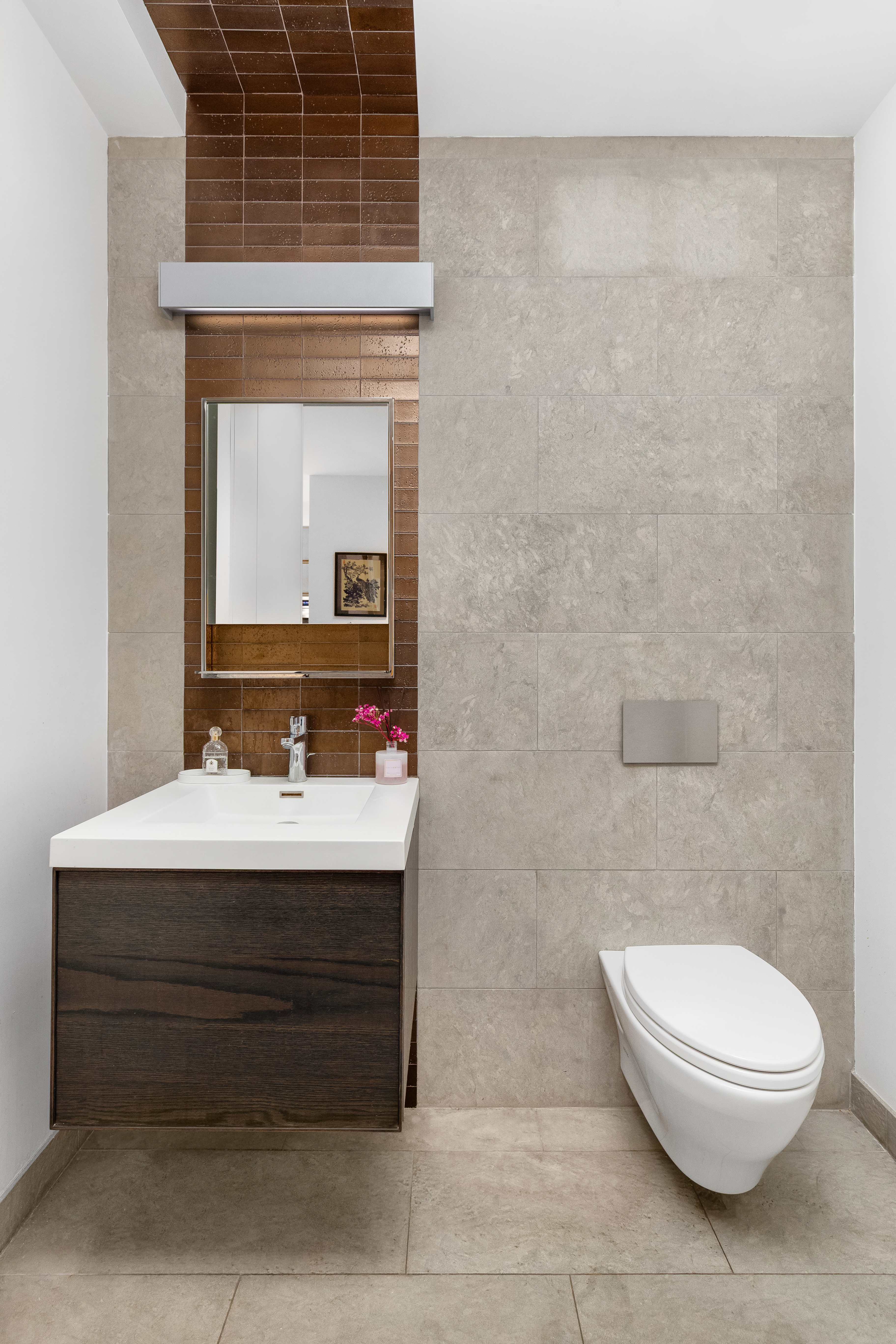 90 Lexington Avenue, Unit MC Manhattan, NY 10016 - Photo 5 of 26 a bathroom with a toilet a sink and mirror