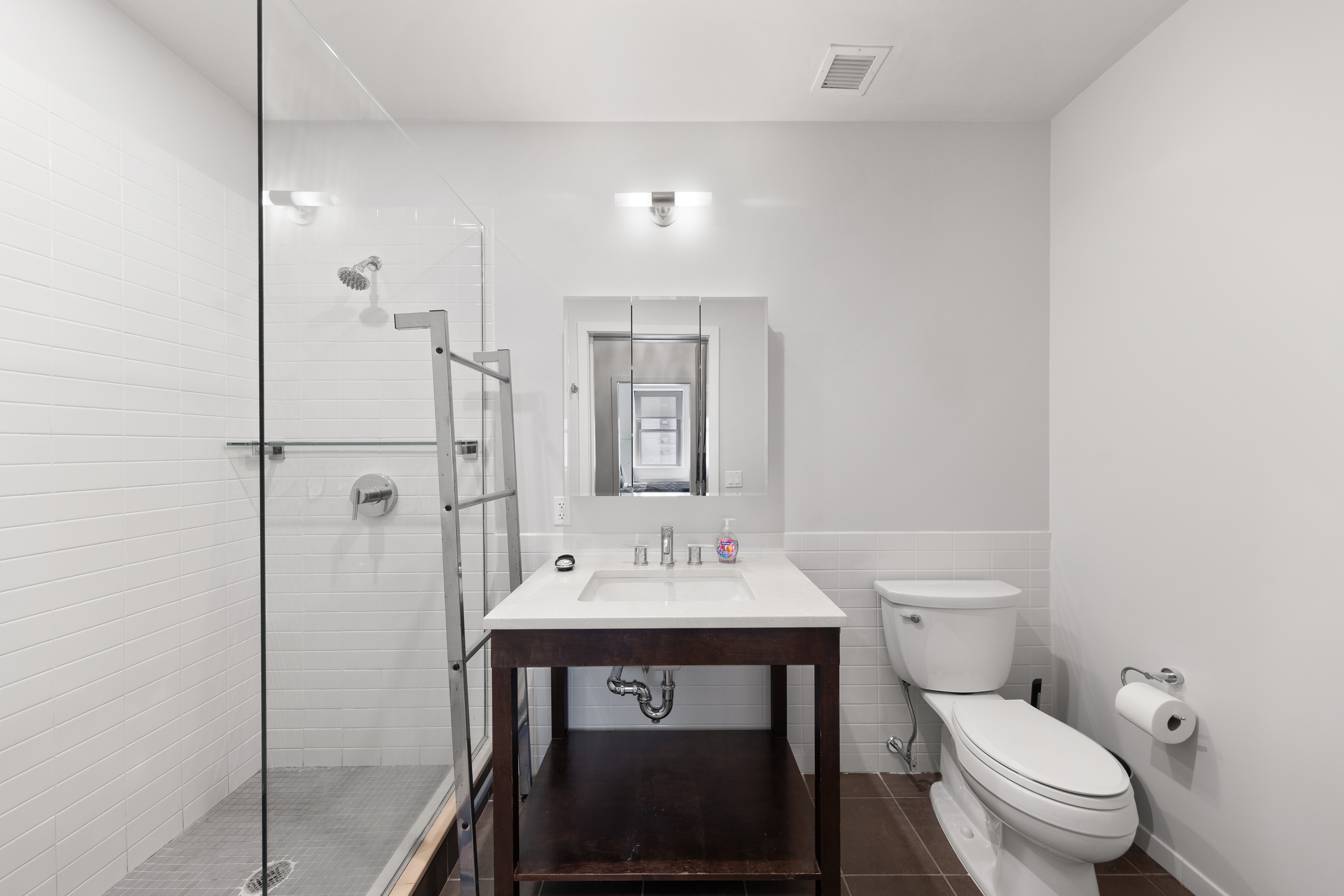 365 Bridge Street, Unit 12H Brooklyn, NY 11201 - Photo 6 of 12 a bathroom with a sink toilet and shower