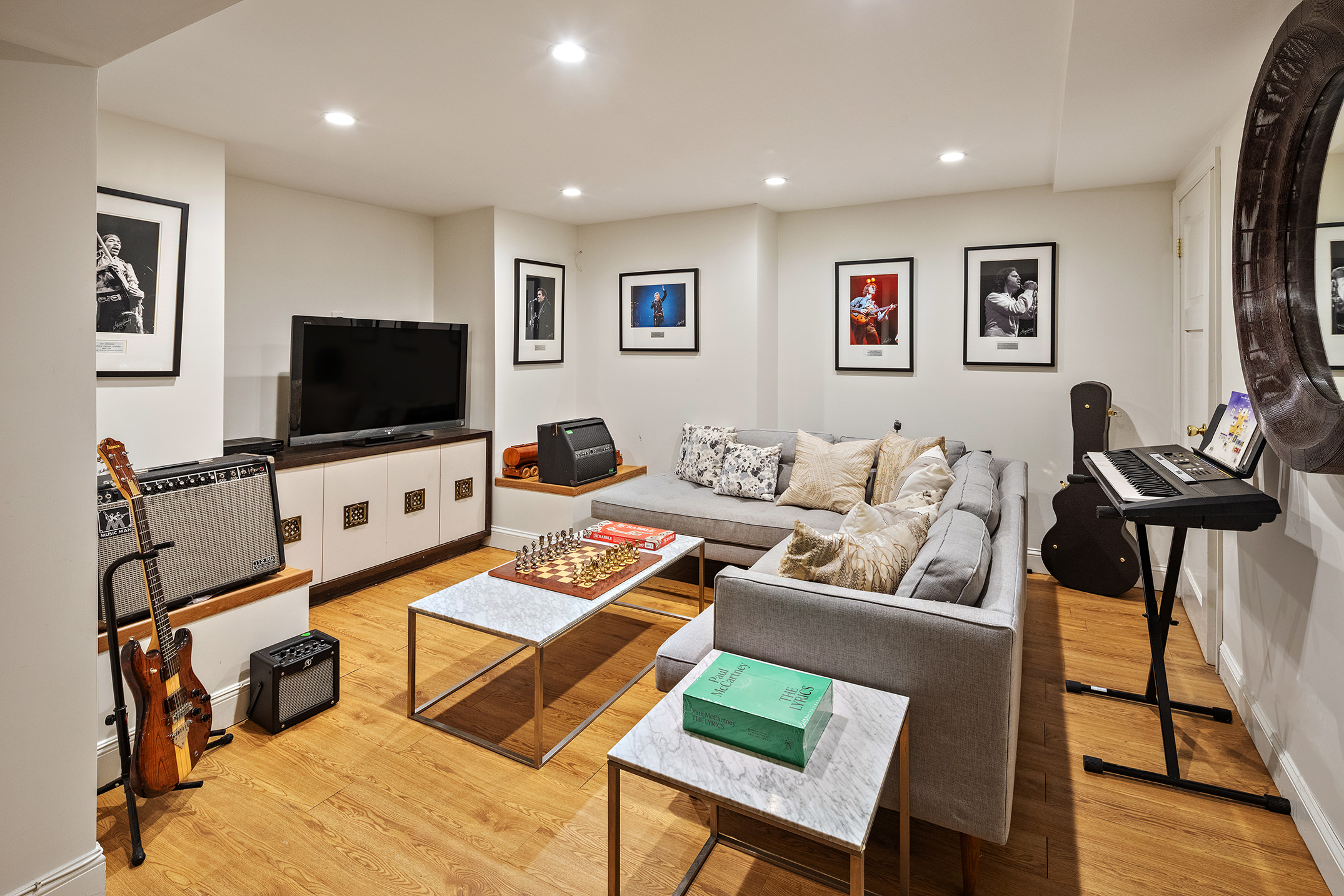 162 Argyle Road Brooklyn, NY 11218 - Photo 21 of 25 a living room with furniture and a flat screen tv