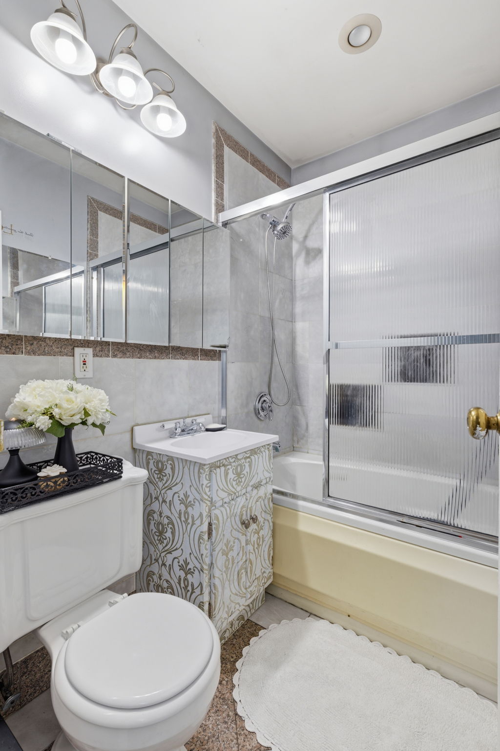 436 Chauncey Street, Unit 4 Brooklyn, NY 11233 - Photo 6 of 7 a bathroom with a sink a toilet and bathtub