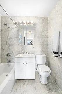 a bathroom with a toilet sink and a bathtub