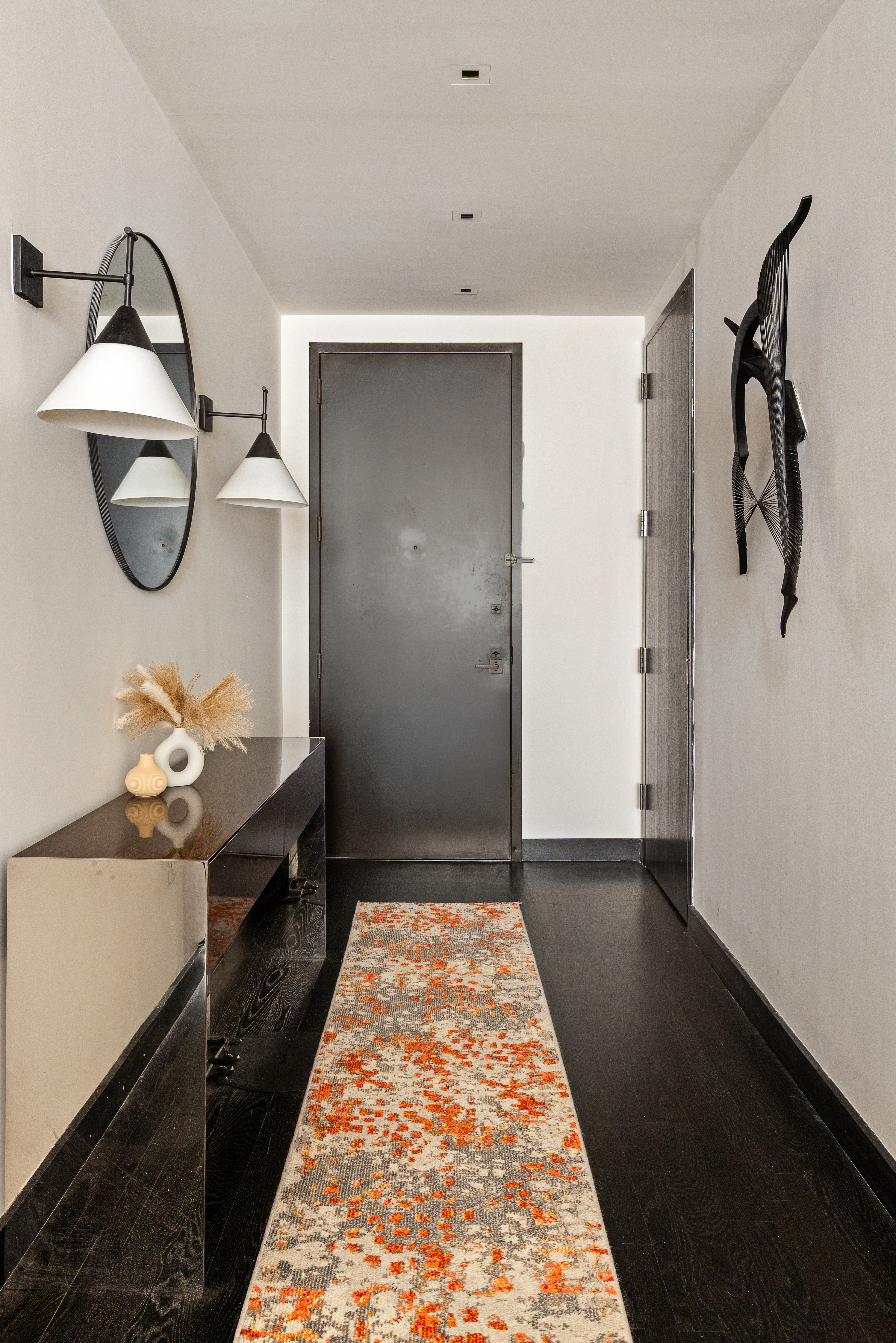 20 Pine Street, Unit 1205 Manhattan, NY 10005 - Photo 9 of 17 a hallway with a stove