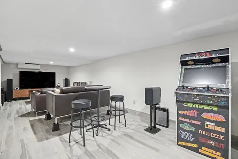 a view of a livingroom with furniture and a flat screen tv