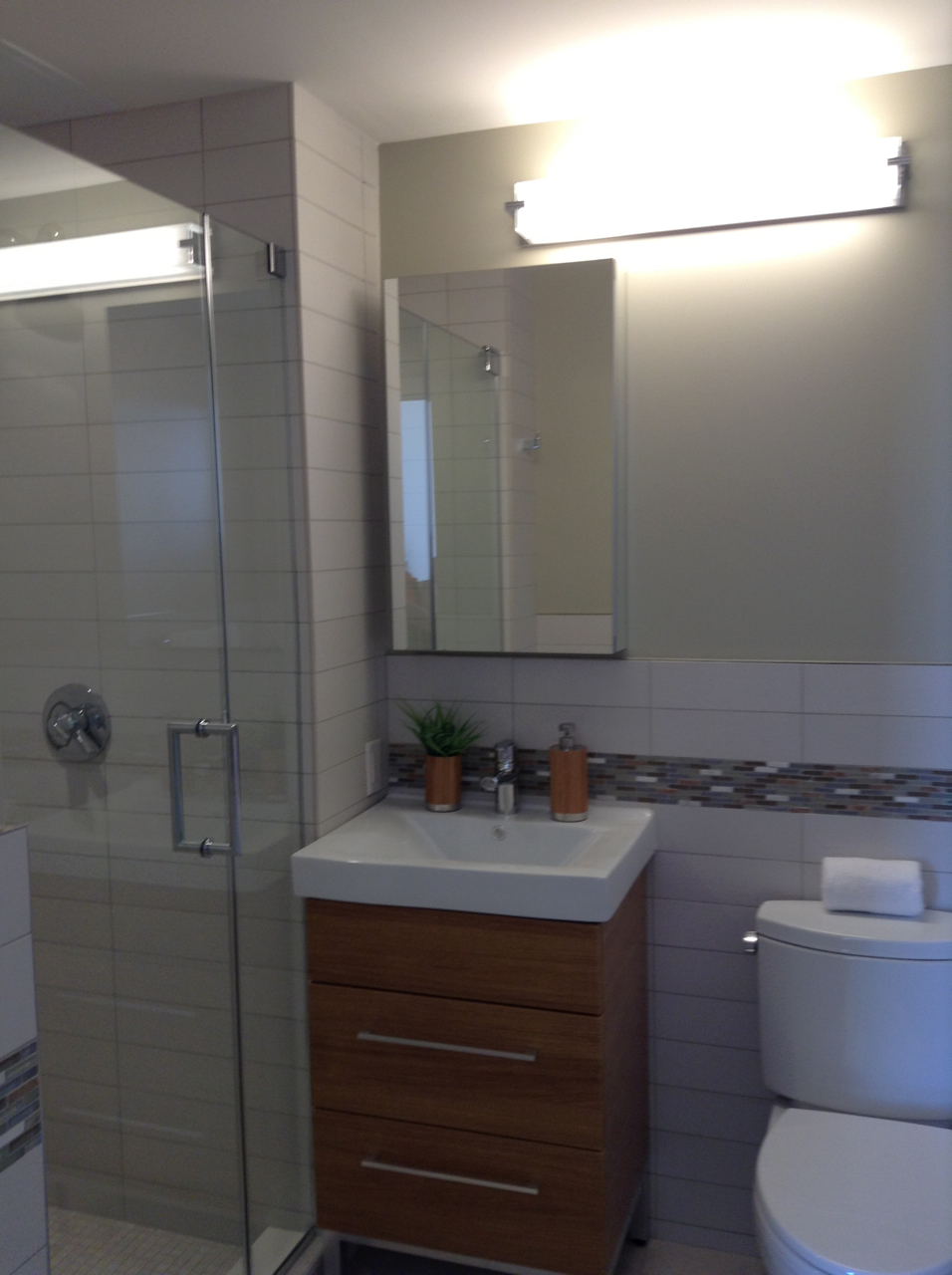 548 4th Avenue, Unit 8A Brooklyn, NY 11215 - Photo 20 of 21 a bathroom with a sink a toilet and shower