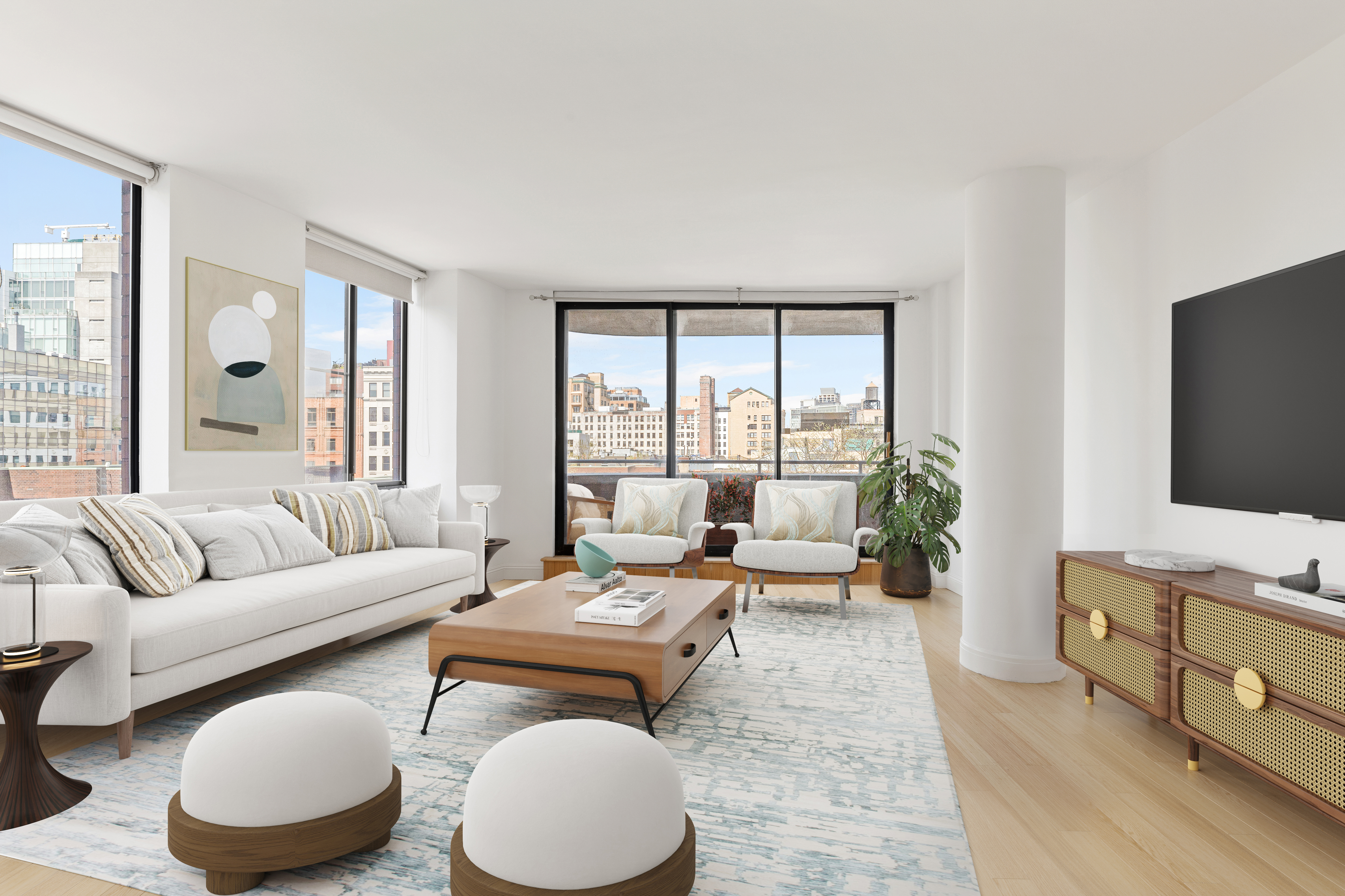 a living room with furniture and a flat screen tv