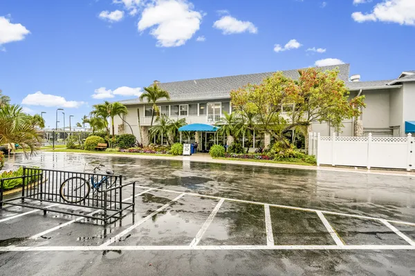 a view of a swimming pool with an outdoor seating