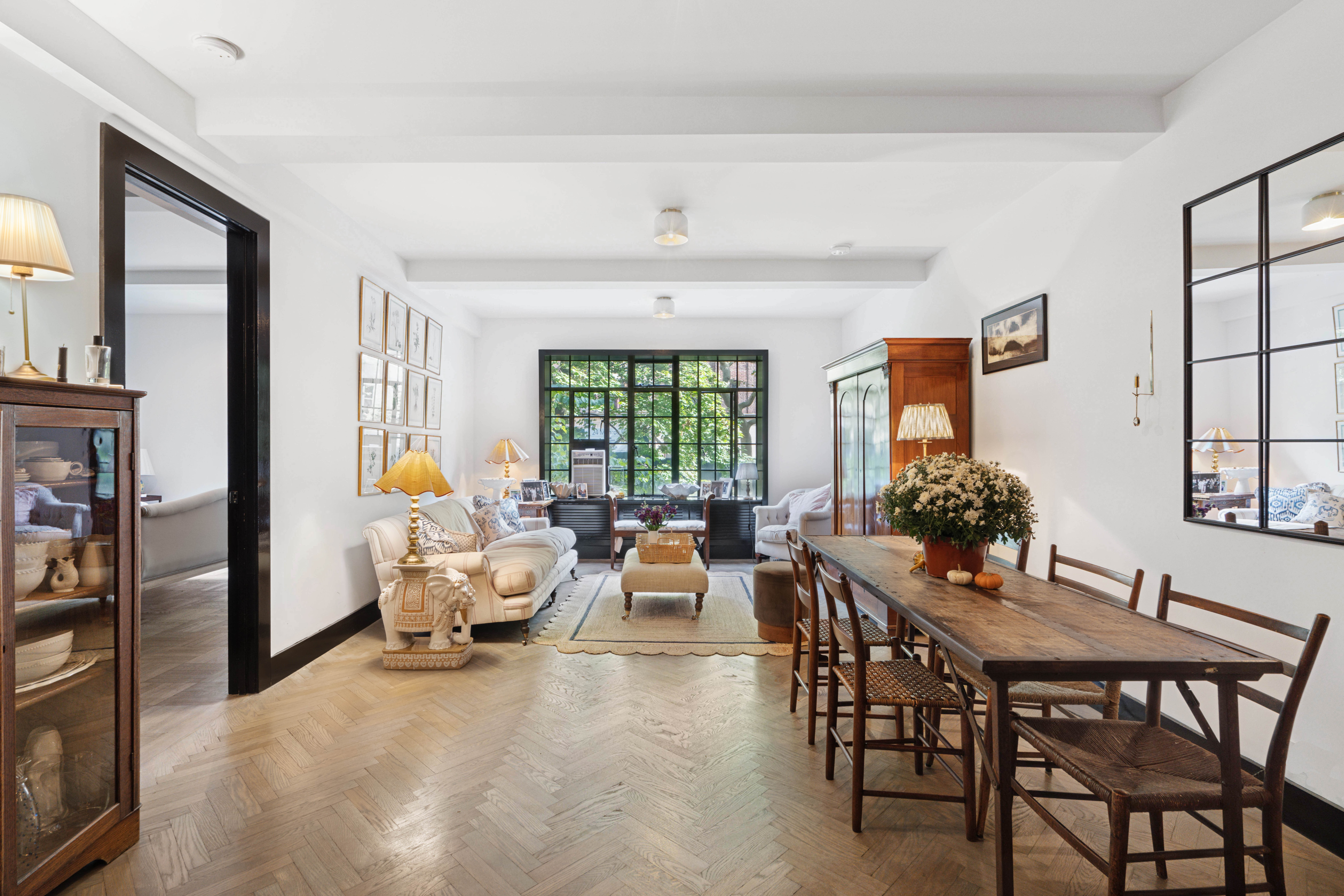 25 Monroe Place, Unit 2A Brooklyn, NY 11201 - Photo 1 of 14 a living room with furniture and a window