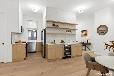 a kitchen with sink cabinets and stainless steel appliances
