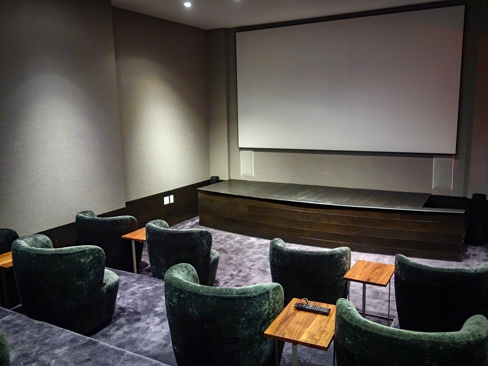 50 West Street, Unit 14B Manhattan, NY 10006 - Photo 27 of 29 a living room with furniture and a lamp