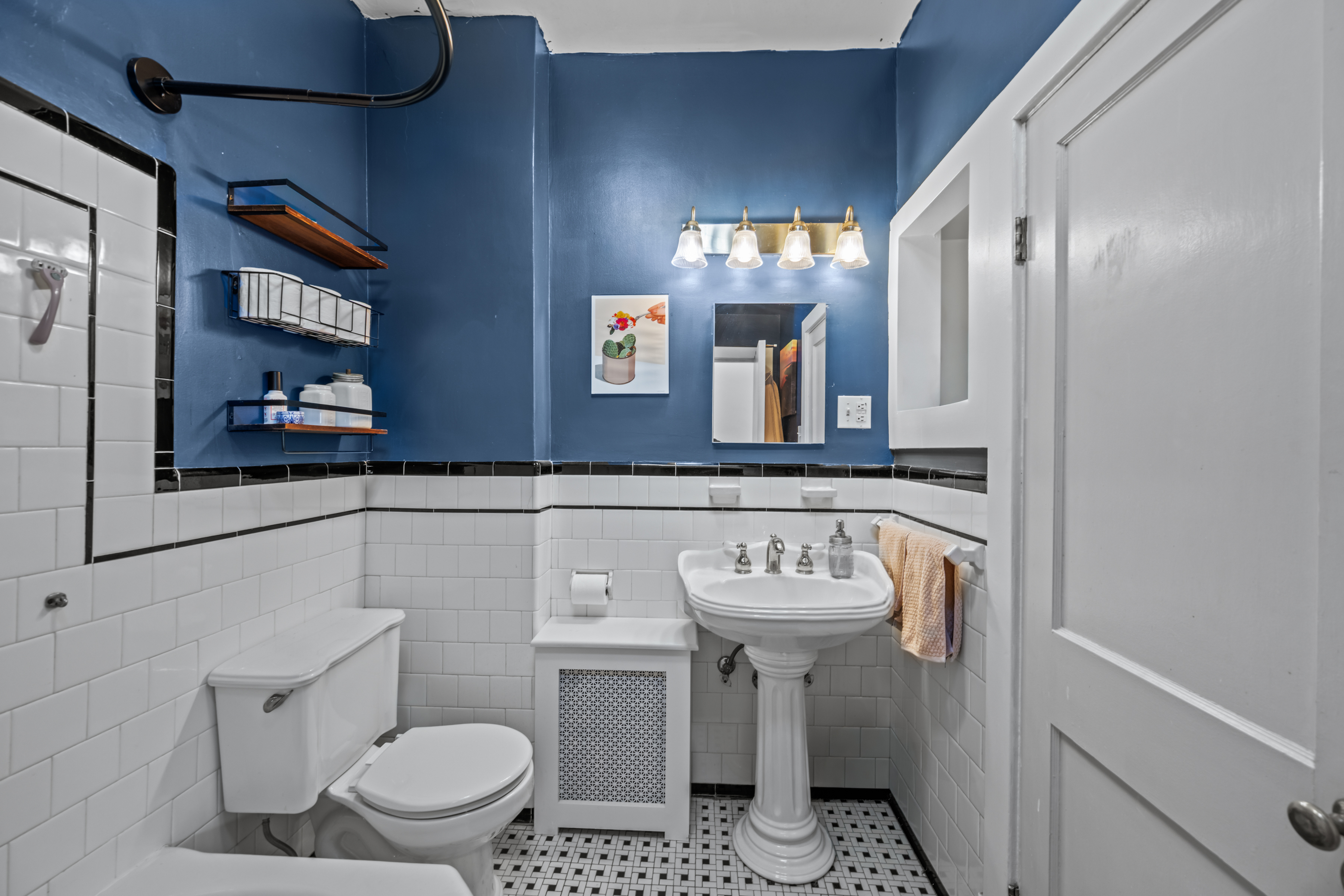 633 South Conkling Street Baltimore, MD 21224 - Photo 11 of 23 a bathroom with a sink toilet and mirror