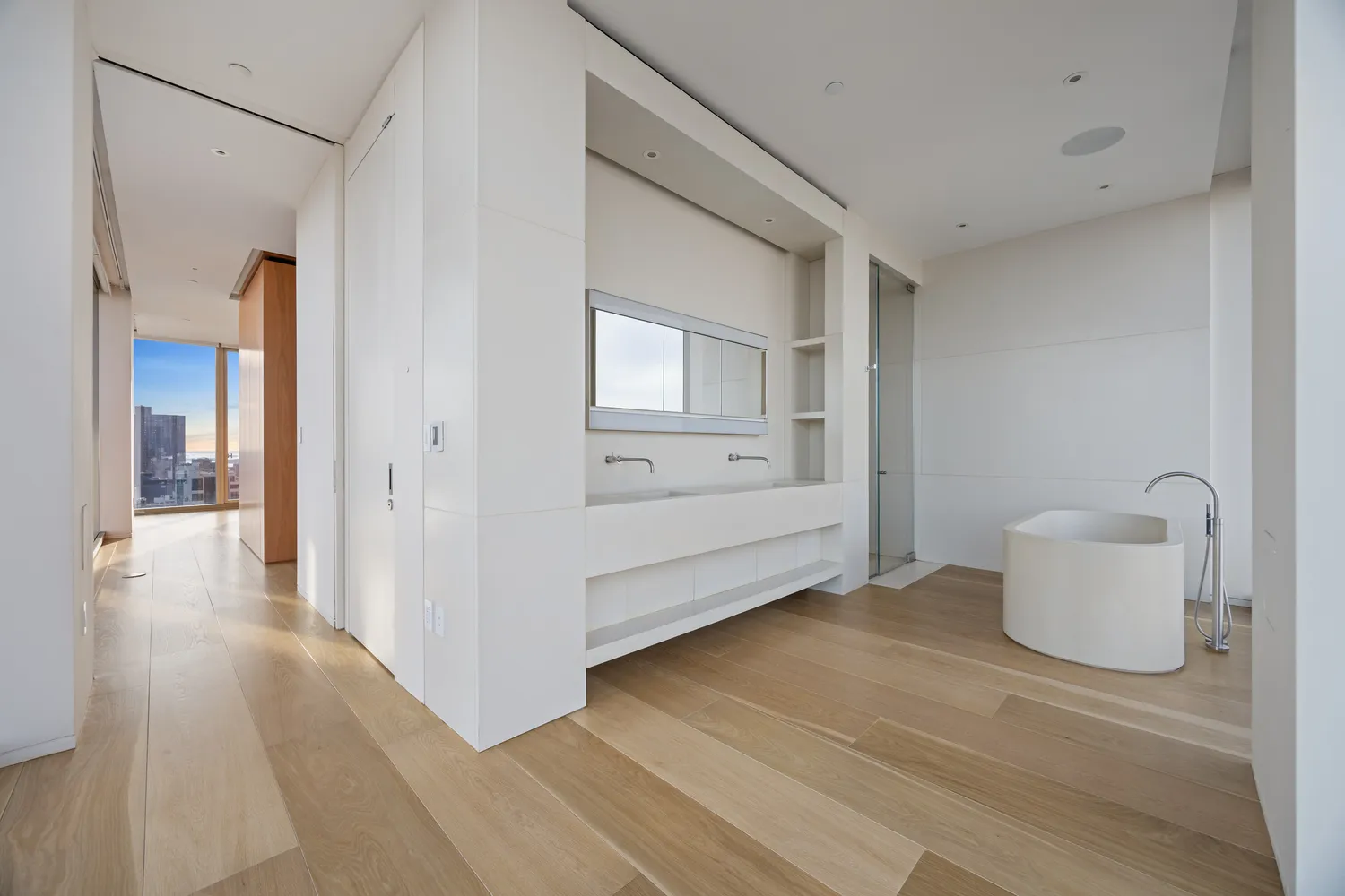 a view of a room with wooden floor and cabinet
