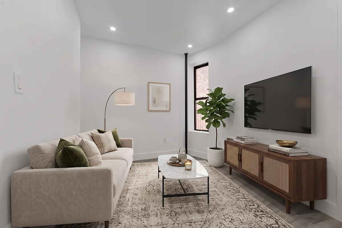 301 East 90th Street, Unit 4C Manhattan, NY 10128 - Photo 3 of 11 a living room with furniture and a flat screen tv
