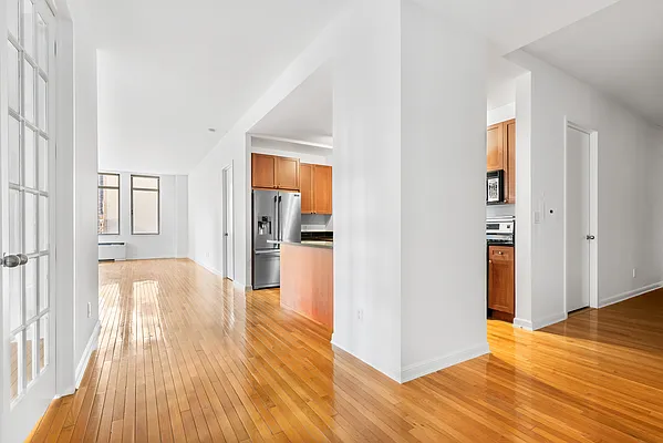 252 7th Avenue, Unit 10I Manhattan, NY 10001 - Photo 5 of 25 a view of empty room with wooden floor