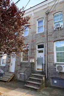 a front view of a house with stairs
