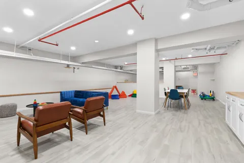 a room with furniture and a wooden floor