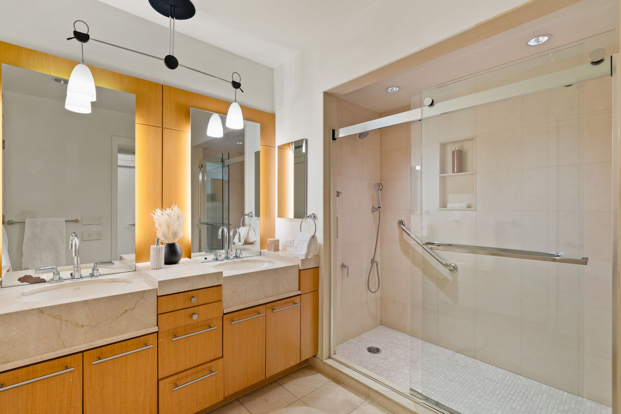 1820 Rittenhouse Square, Unit 601 Philadelphia, PA 19103 - Photo 4 of 4 a bathroom with a double vanity sink mirror and shower