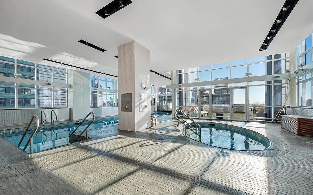 350 West 42nd Street, Unit 12C Manhattan, NY 10036 - Photo 11 of 21 a view of a livingroom with furniture and a window