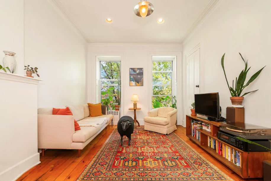 464 Macon Street, Unit 2 Brooklyn, NY 11233 - Photo 1 of 9 a living room with furniture and a flat screen tv