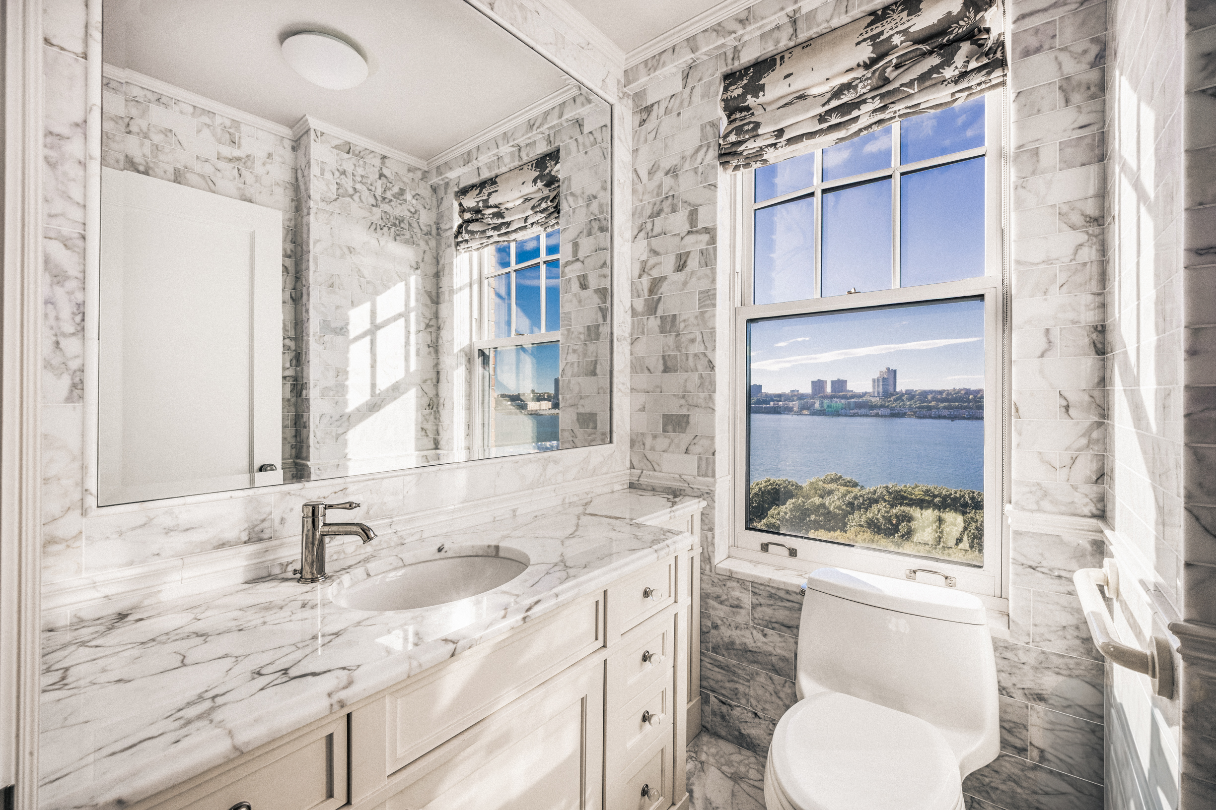 33 Riverside Drive, Unit 13AB Manhattan, NY 10023 - Photo 15 of 19 a bathroom with a granite countertop sink toilet and shower