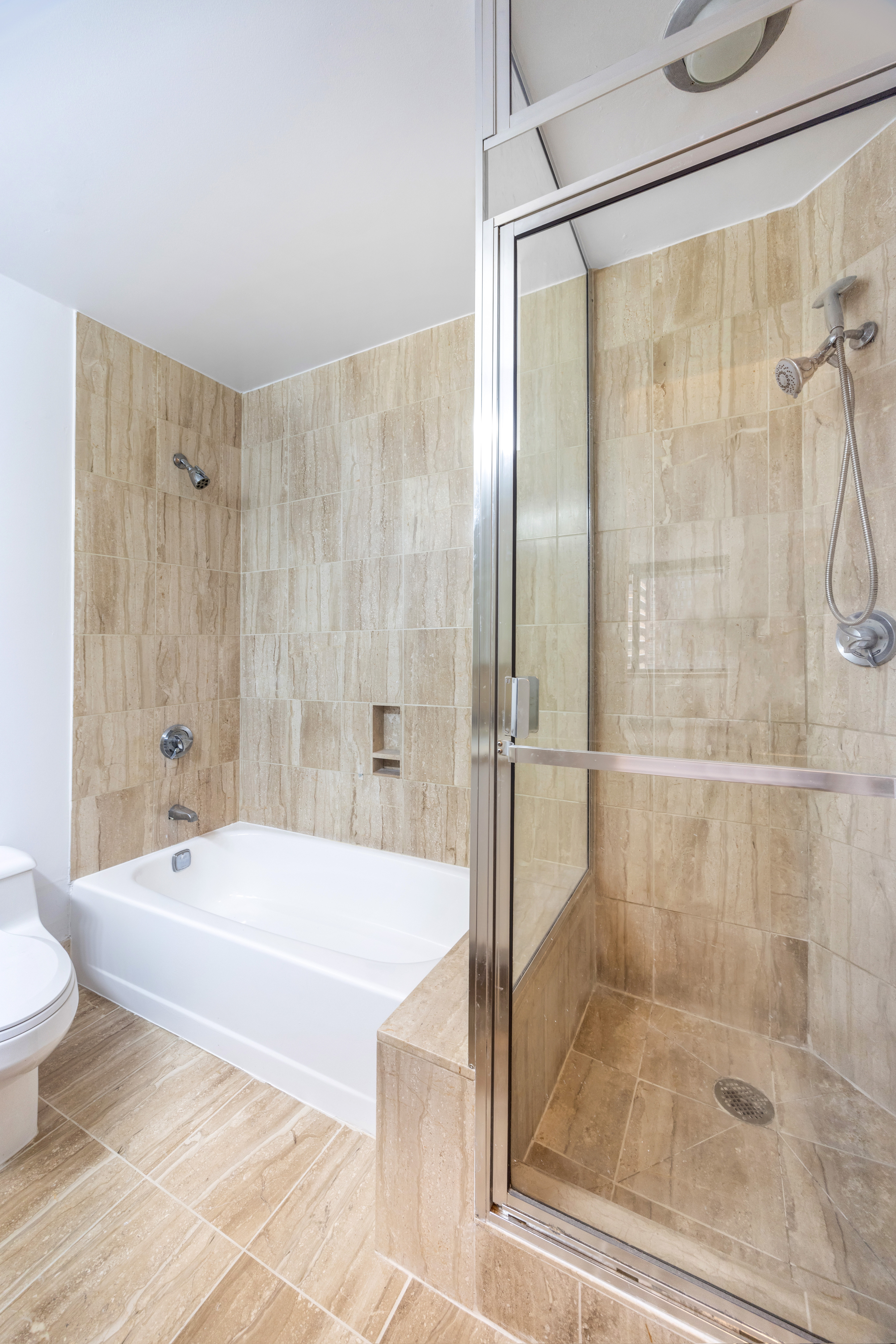 415 East 37th Street, Unit 16F Manhattan, NY 10016 - Photo 6 of 10 a bathroom with a shower and a sink