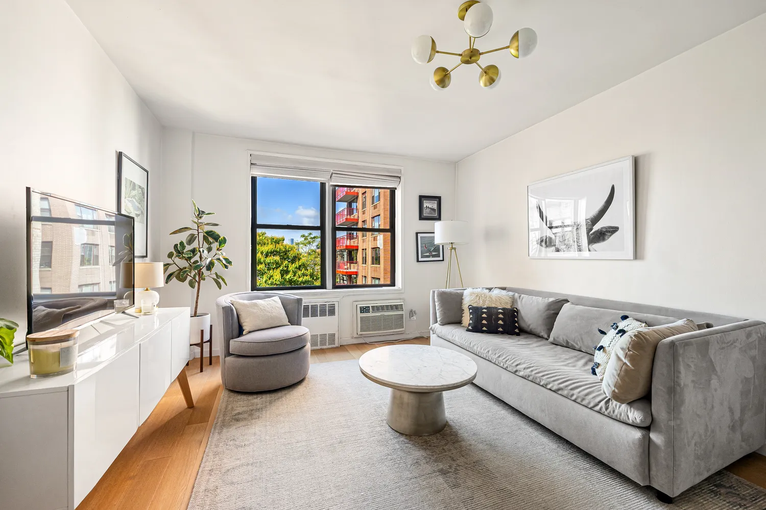 a living room with furniture and a large window