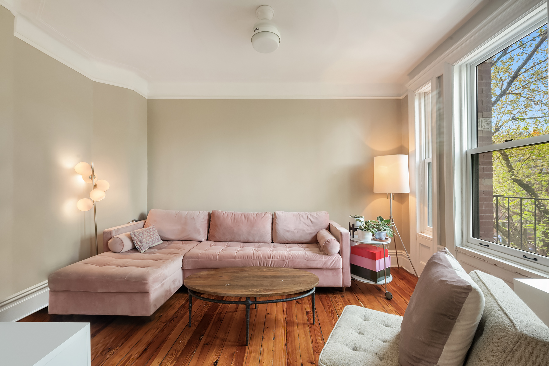 84 Charles Street, Unit 13 Manhattan, NY 10014 - Photo 3 of 8 a living room with furniture and a large window