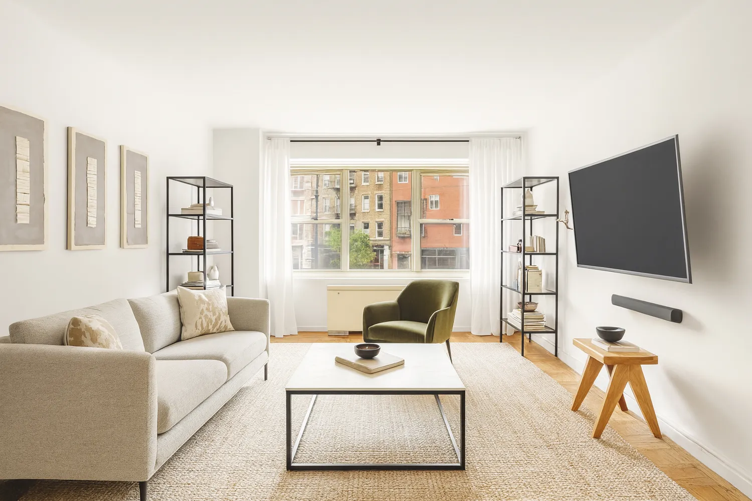 a living room with furniture and a flat screen tv