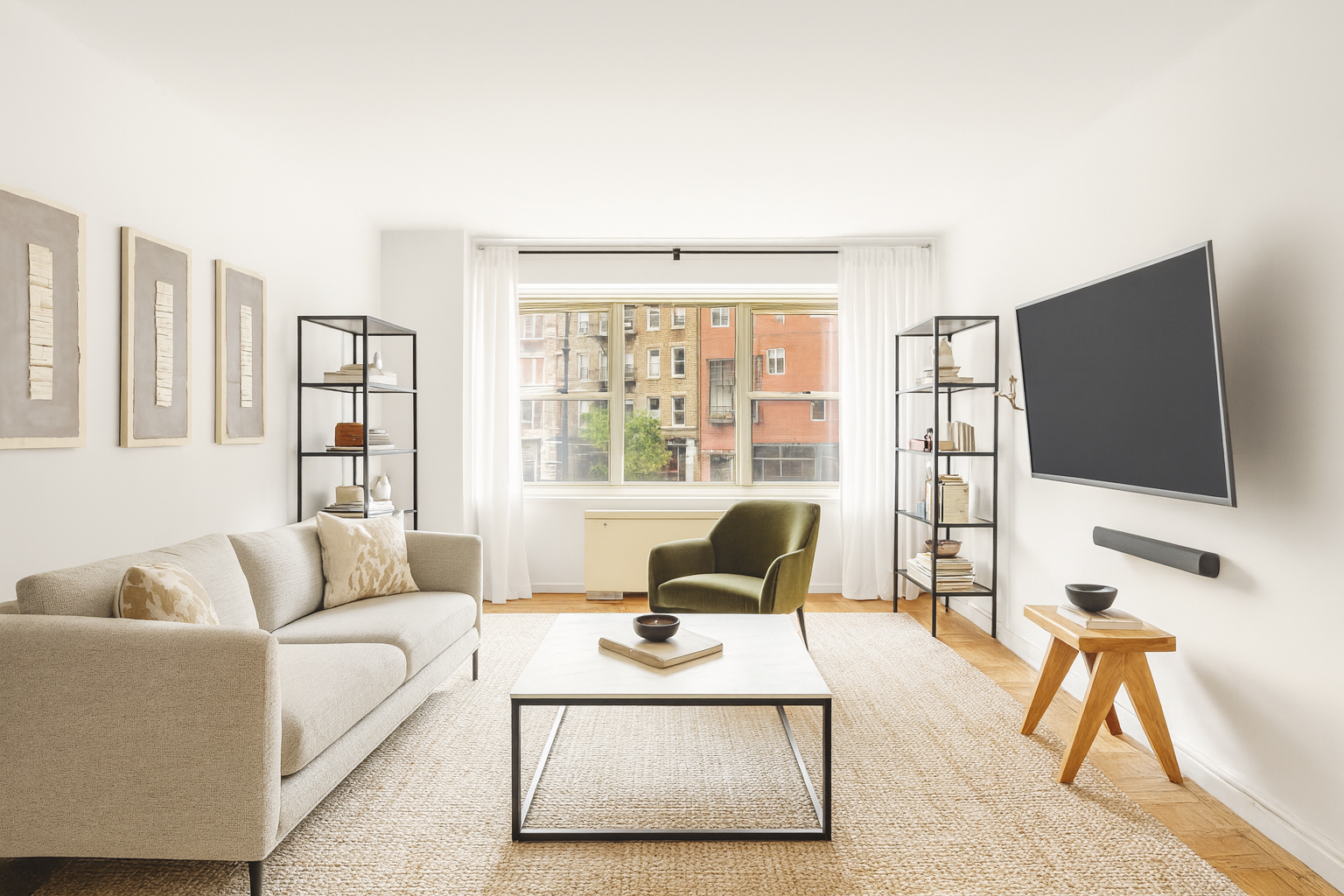 a living room with furniture and a flat screen tv