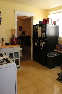 a kitchen with a stove and a refrigerator