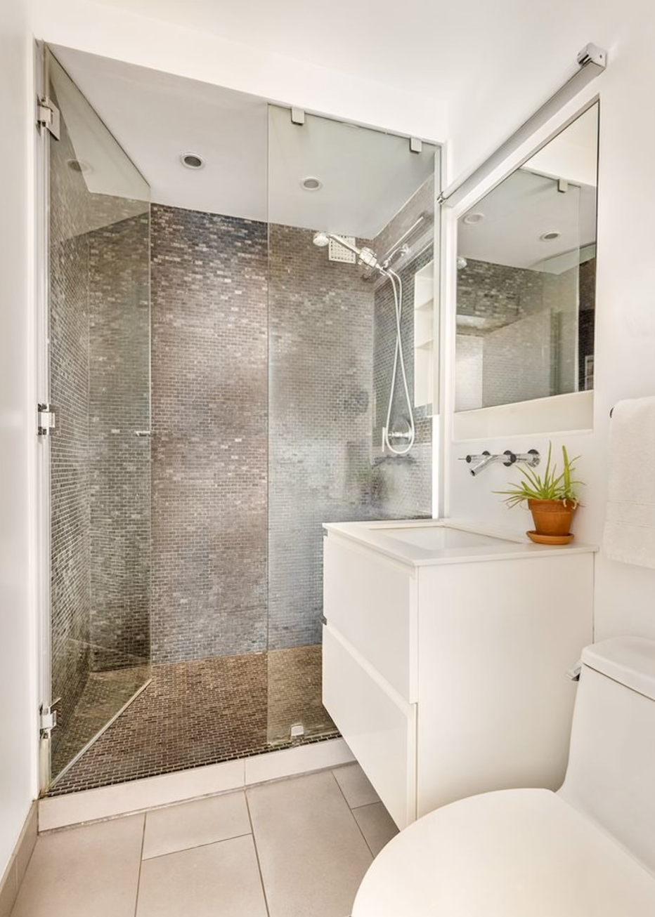 15 Charles Street, Unit 6G Manhattan, NY 10014 - Photo 8 of 14 a bathroom with a sink and a shower