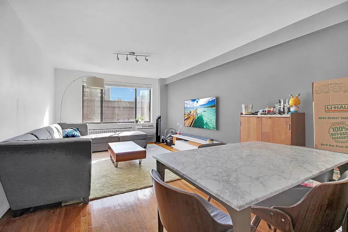 250 East 31st Street, Unit 5A Manhattan, NY 10016 - Photo 2 of 7 a living room with furniture and a table