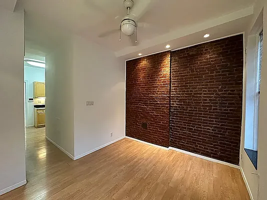 1313 3rd Avenue, Unit PH5 Manhattan, NY 10021 - Photo 2 of 5 a view of empty room with wooden floor
