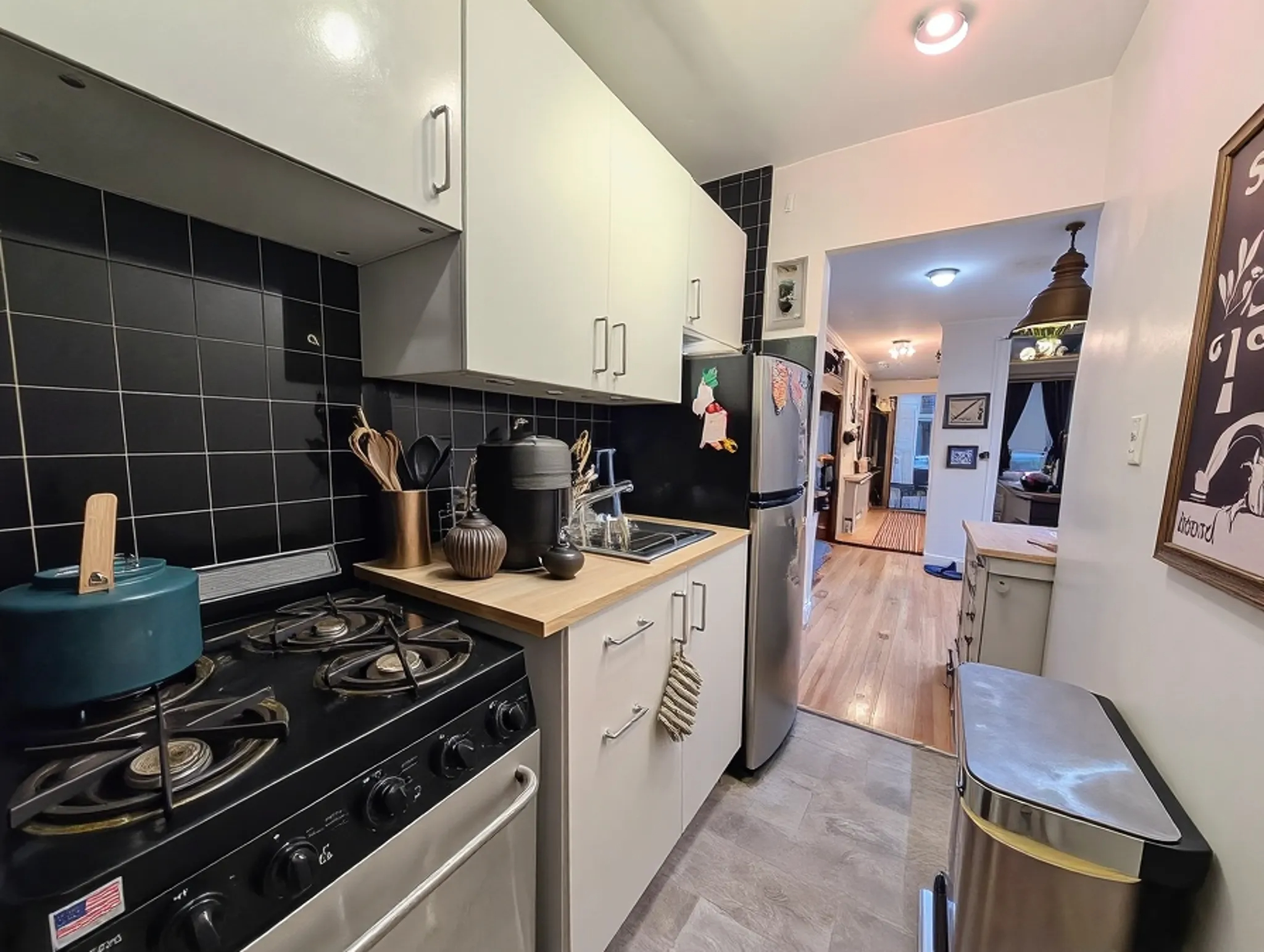 49 Saint Marks Avenue, Unit 1 Brooklyn, NY 11217 - Photo 14 of 21 a kitchen with a stove and cabinets