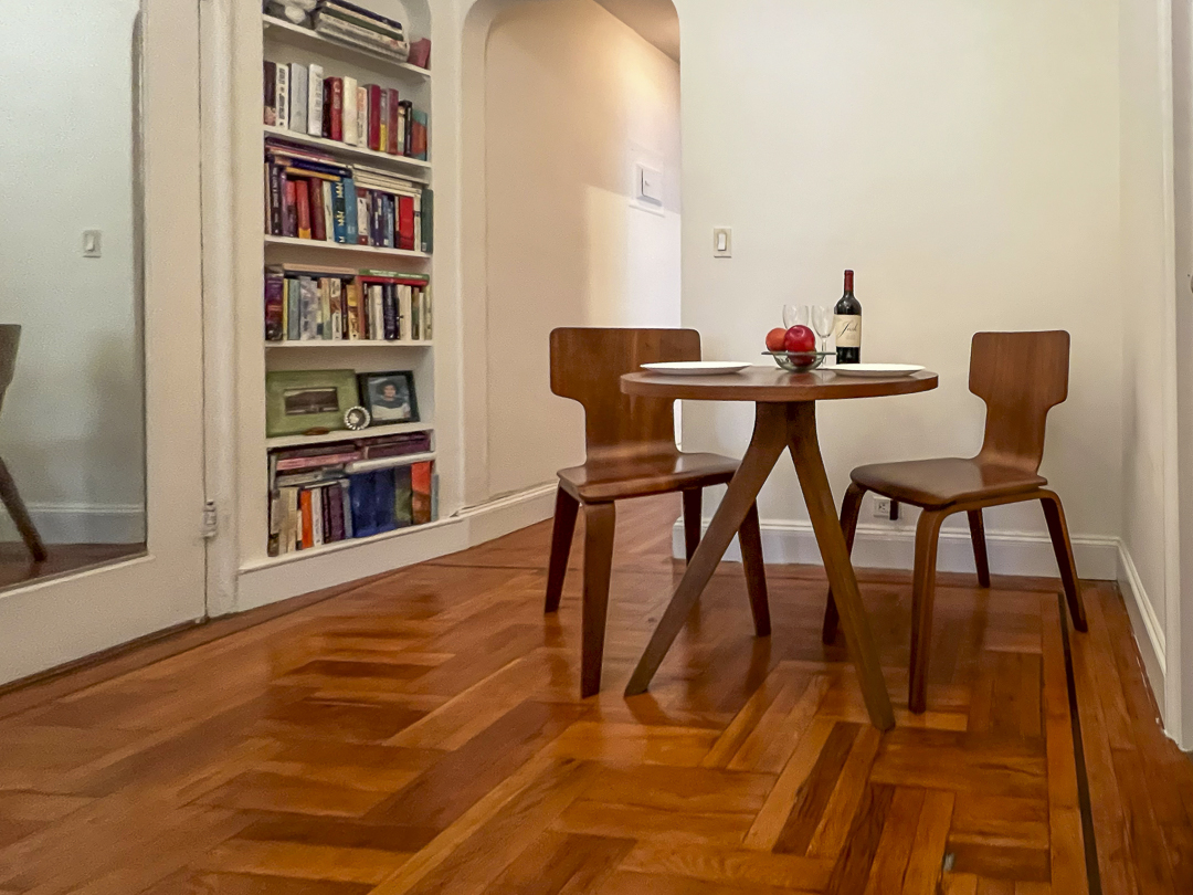 208 East 28th Street, Unit 4A Manhattan, NY 10016 - Photo 4 of 12 a workspace with furniture and a book shelf