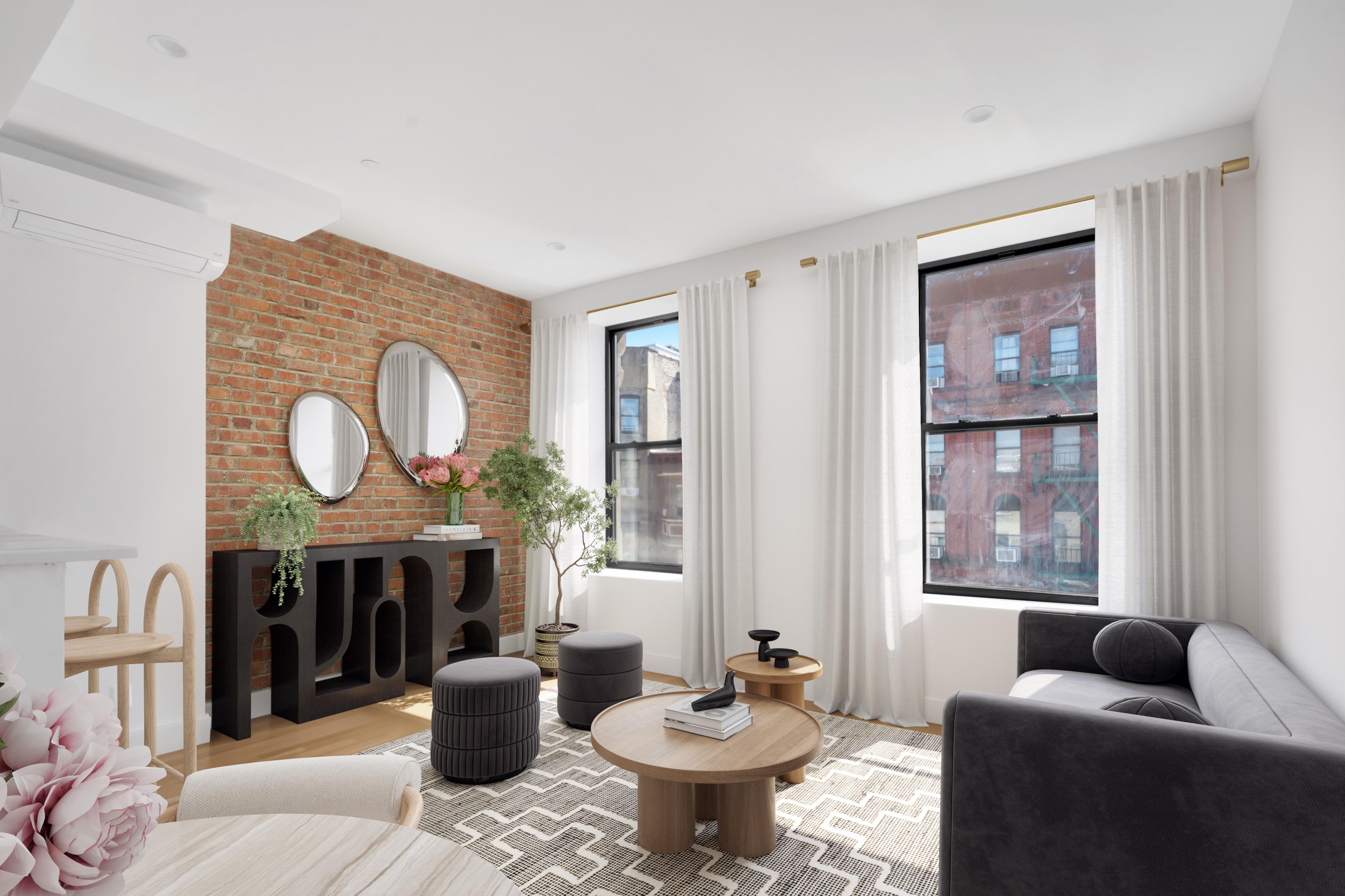 145 West 129th Street, Unit 3 Manhattan, NY 10027 - Photo 3 of 11 a living room with furniture and a large window