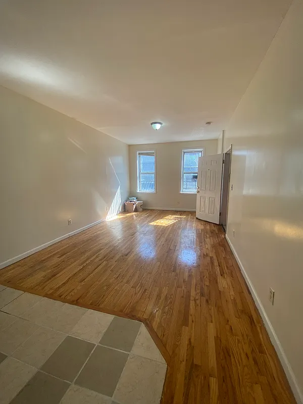 1251 Saint Marks Avenue, Unit 2 Brooklyn, NY 11213 - Photo 2 of 5 a view of a livingroom with wooden floor