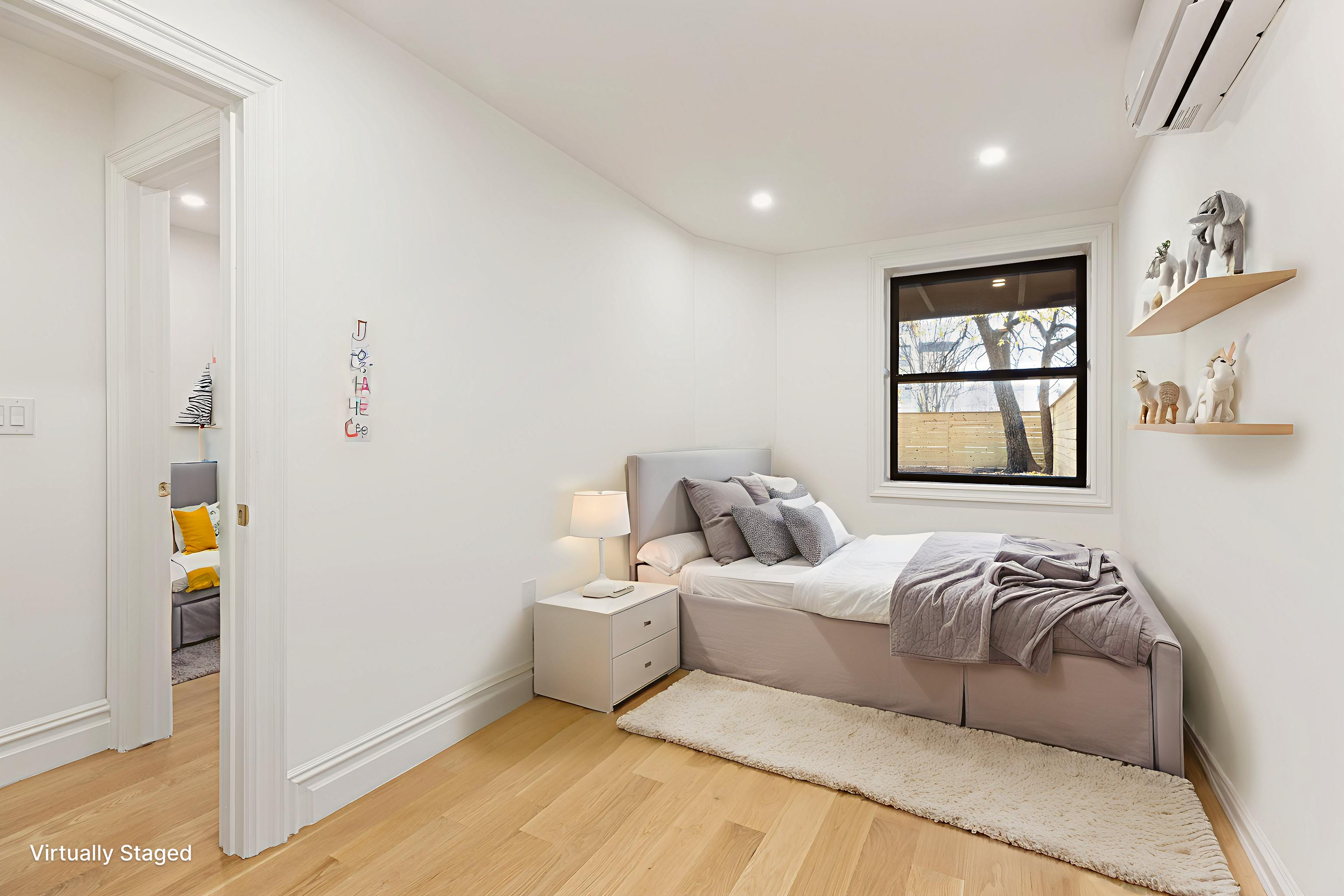 15 Verona Place, Unit GARDEN Brooklyn, NY 11216 - Photo 6 of 14 a bedroom with a bed and a window