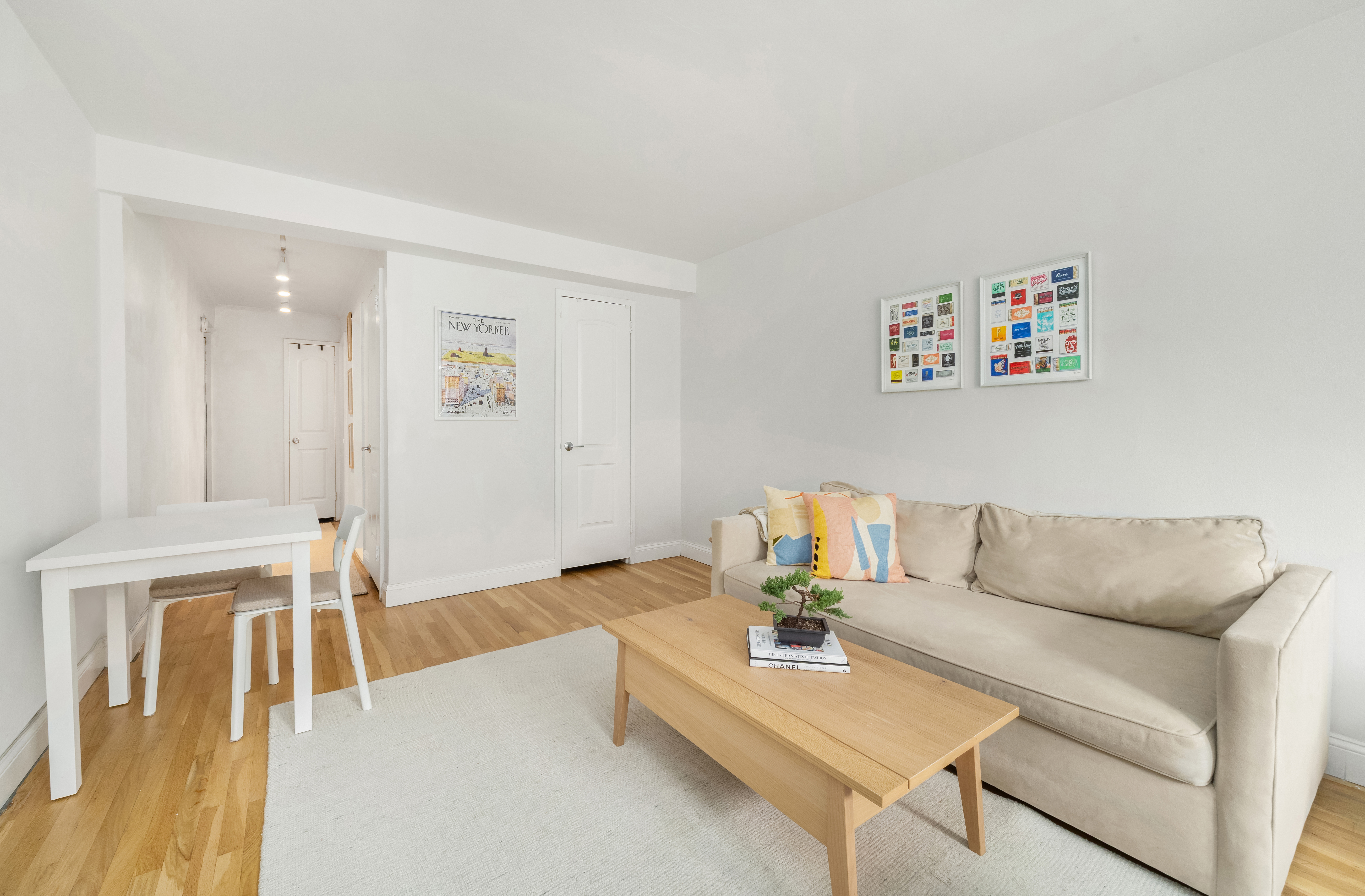 25 West 13th Street, Unit 6ON Manhattan, NY 10011 - Photo 4 of 7 a living room with furniture and a table