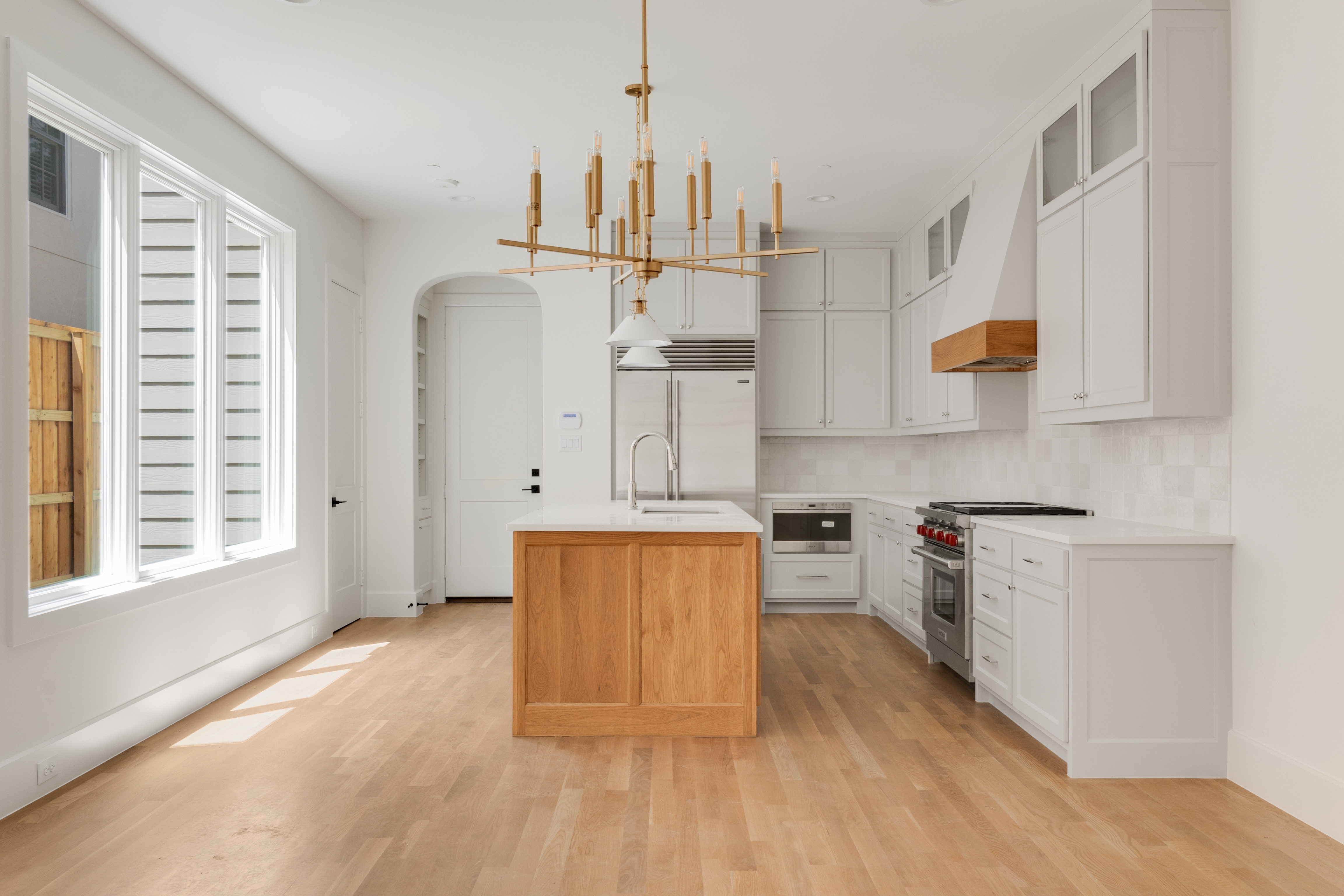 4410 Glenwick Lane Dallas, TX 75205 - Photo 8 of 28 a kitchen with stainless steel appliances granite countertop a stove a sink and a refrigerator