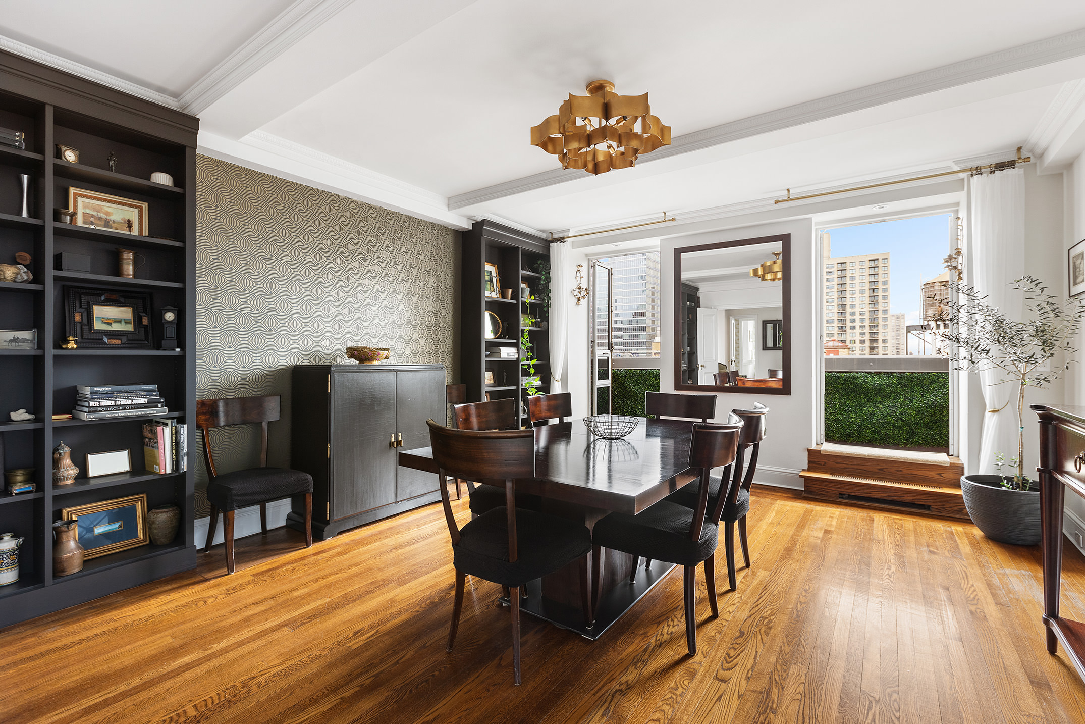 320 East 72nd Street, Unit PHB Manhattan, NY 10021 - Photo 6 of 26 a view of a dining room with furniture and wooden floor