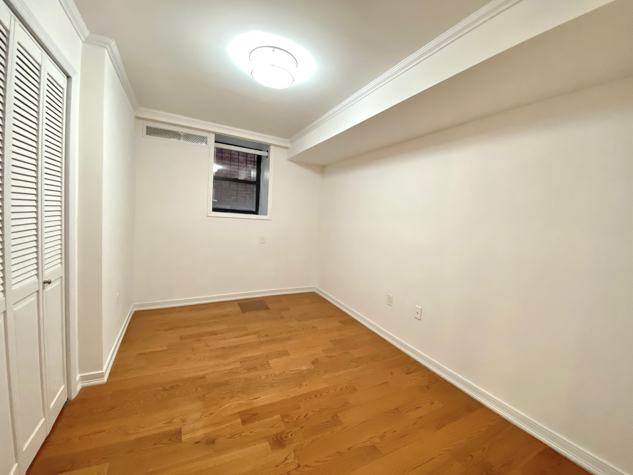 573 6th Street, Unit 3 Brooklyn, NY 11215 - Photo 13 of 19 an empty room with a empty space and windows