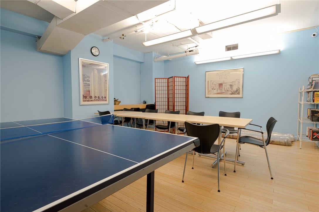 515 East 79th Street, Unit 15A Manhattan, NY 10075 - Photo 16 of 26 a living room with chairs and a table with wooden floor
