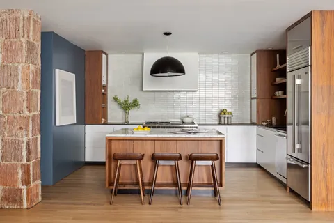 a kitchen with a table and chairs in it