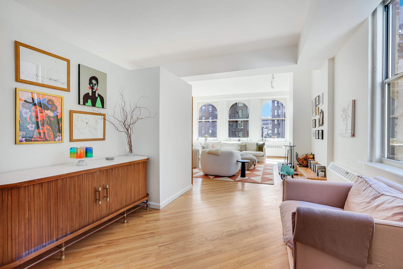 35 East 12th Street, Unit 8C Manhattan, NY 10003 - Photo 21 of 22 a living room with furniture and wooden floor