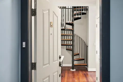 a view of entryway with wooden floor