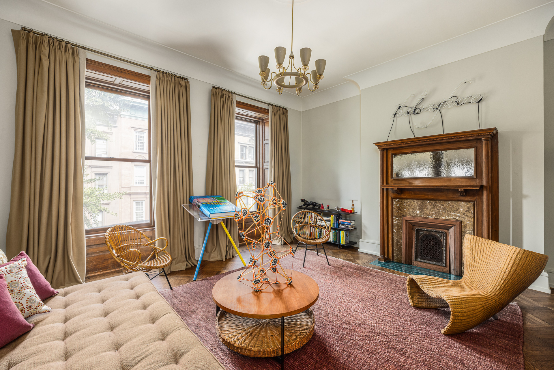 22 West 70th Street Manhattan, NY 10023 - Photo 10 of 12 a living room with furniture a fireplace and a flat screen tv