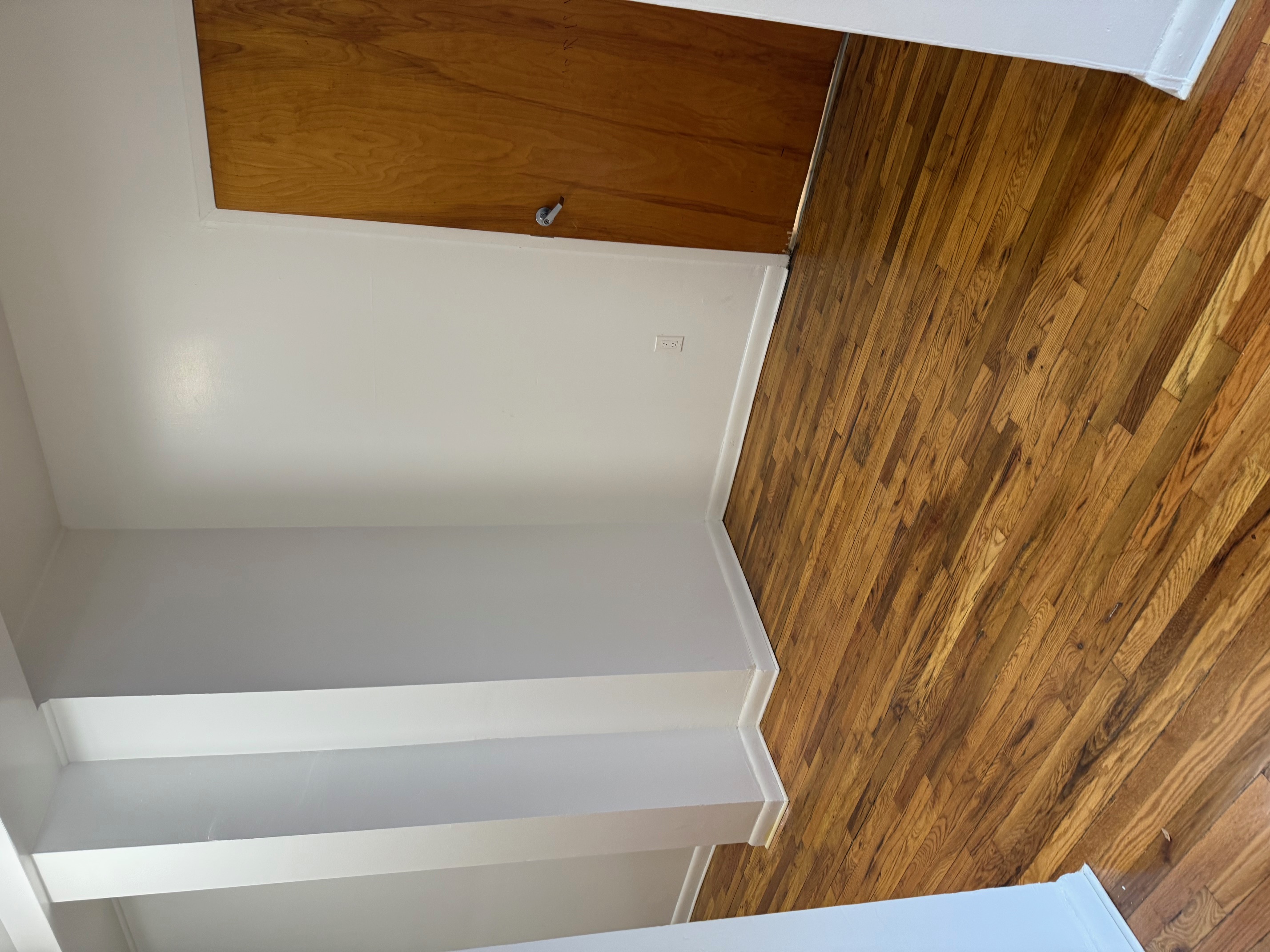 80 St Nicholas Avenue, Unit 1C Manhattan, NY 10026 - Photo 3 of 8 a view of empty room with wooden floor